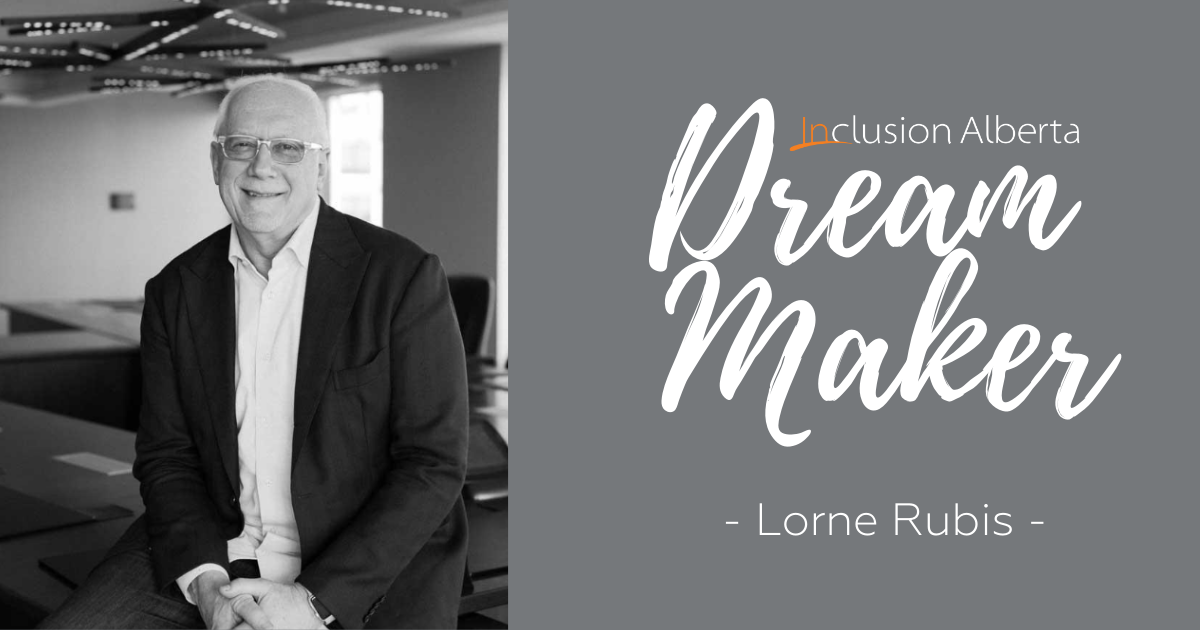 Inclusion Alberta Dream Maker - Lorne Rubis Lorne is pictured posing, wearing a suit.
